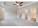 Bedroom showcasing neutral carpet, ceiling fan, and access to closet and ensuite bathroom at 3160 Washburn Sw St, Atlanta, GA 30354