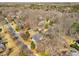 Aerial view of a neighborhood with mature trees, winding streets, and established homes at 3345 Highgate Hills Ne Dr, Duluth, GA 30097