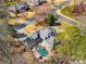 Aerial view of the property showcasing the in-ground pool, backyard, and surrounding neighborhood at 3345 Highgate Hills Ne Dr, Duluth, GA 30097