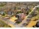 A high angle view of a home from above nestled in a neighborhood with mature trees at 3345 Highgate Hills Ne Dr, Duluth, GA 30097