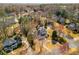 Aerial view of a neighborhood featuring large homes on manicured lots with mature trees at 3345 Highgate Hills Ne Dr, Duluth, GA 30097