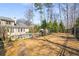 Expansive backyard featuring an in-ground pool, lush greenery, and a charming patio area at 3345 Highgate Hills Ne Dr, Duluth, GA 30097