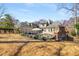 Large grassy backyard with in-ground pool, patio, and view of the house at 3345 Highgate Hills Ne Dr, Duluth, GA 30097