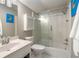 Compact bathroom features a shower-tub combination and ample storage space at 3345 Highgate Hills Ne Dr, Duluth, GA 30097