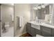 Modern bathroom boasts stylish vanity with farmhouse sink and attractive lighting at 3345 Highgate Hills Ne Dr, Duluth, GA 30097
