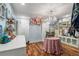 Chic dressing room with hardwood floors, chandelier, and custom clothing racks at 3345 Highgate Hills Ne Dr, Duluth, GA 30097