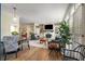 Comfortable living room featuring a fireplace, ample seating, and lots of natural light at 3345 Highgate Hills Ne Dr, Duluth, GA 30097