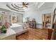 Spacious main bedroom featuring tray ceilings, hardwood floors, and access to an ensuite bath at 3345 Highgate Hills Ne Dr, Duluth, GA 30097