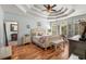 Serene primary bedroom features a tray ceiling, hardwood floors, and abundant natural light at 3345 Highgate Hills Ne Dr, Duluth, GA 30097
