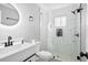 Modern bathroom featuring elegant vanity and fixtures, a glass-enclosed shower, and a sleek design at 884 N Eugenia Nw Pl, Atlanta, GA 30318