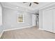 Bright and airy bedroom featuring an updated ceiling fan, and closet at 884 N Eugenia Nw Pl, Atlanta, GA 30318