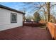 Wide deck with wood railing, attached to house with white siding and dark trim at 884 N Eugenia Nw Pl, Atlanta, GA 30318
