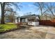 Charming brick home featuring a long driveway and stylish black-and-white trim at 884 N Eugenia Nw Pl, Atlanta, GA 30318