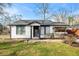 Charming brick home featuring a well-manicured lawn and stylish black-and-white trim at 884 N Eugenia Nw Pl, Atlanta, GA 30318