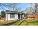 Angle view of a beautiful home featuring a well-manicured lawn and stylish black-and-white trim at 884 N Eugenia Nw Pl, Atlanta, GA 30318