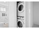 Efficient laundry area features a stacked washer and dryer, maximizing space and convenience at 884 N Eugenia Nw Pl, Atlanta, GA 30318