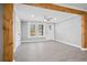 Bright and airy open-concept living area featuring modern flooring, wooden beams and lots of natural light at 884 N Eugenia Nw Pl, Atlanta, GA 30318