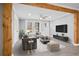 Bright and airy staged living area featuring modern flooring, wooden beams, decor and lots of natural light at 884 N Eugenia Nw Pl, Atlanta, GA 30318