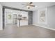 Open living area featuring neutral tones, a large window, and an adjoined kitchen at 884 N Eugenia Nw Pl, Atlanta, GA 30318