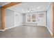 Bright and airy empty living area featuring modern flooring, wooden beams and lots of natural light at 884 N Eugenia Nw Pl, Atlanta, GA 30318