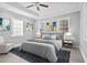 Spacious main bedroom featuring a tray ceiling, neutral color palette, and plenty of natural light at 884 N Eugenia Nw Pl, Atlanta, GA 30318