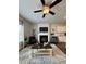 Cozy living area with fireplace, built-in shelving, modern decor, and an accent rug at 1027 Northfield Dr, Conyers, GA 30013
