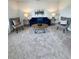 Cozy living area with comfortable seating, accent tables, modern decor, and a plush carpet at 1027 Northfield Dr, Conyers, GA 30013