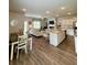 Open-concept living space with a view of the kitchen, dining area, and comfortable seating arrangement at 1027 Northfield Dr, Conyers, GA 30013