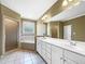 Bright bathroom with double sinks, a soaking tub, and a separate glass shower at 185 Stayman Park, Fayetteville, GA 30215