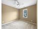 Neutral bedroom with carpet, a ceiling fan, and a window providing natural light at 185 Stayman Park, Fayetteville, GA 30215