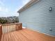 Outdoor deck area with wood railings and siding, providing a cozy and private space at 185 Stayman Park, Fayetteville, GA 30215