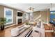 Staged living room features a fireplace, hardwood floors, and plenty of natural light at 185 Stayman Park, Fayetteville, GA 30215