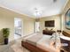 Staged main bedroom with en-suite bathroom, plush carpet, and modern furnishings at 185 Stayman Park, Fayetteville, GA 30215