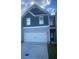 Charming home featuring a two-car garage and well-maintained landscaping at 1029 Northfield Dr, Conyers, GA 30013