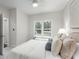 Bright bedroom with ceiling fan, large window overlooking a deck, neutral decor, and plush carpeting at 2358 Alexander Farms Sw Ct, Marietta, GA 30064