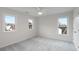 Bright bedroom with plush carpeting, white walls, and double windows offering natural light at 2358 Alexander Farms Sw Ct, Marietta, GA 30064