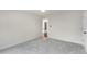 Bedroom featuring neutral carpet, white walls, and an open doorway at 2358 Alexander Farms Sw Ct, Marietta, GA 30064