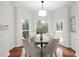 Bright breakfast nook features wood floors, windows, and a door to the deck, perfect for enjoying your coffee at 2358 Alexander Farms Sw Ct, Marietta, GA 30064