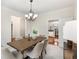 Elegant dining room with a chandelier, comfortable seating for six, and neutral colors at 2358 Alexander Farms Sw Ct, Marietta, GA 30064