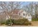 Charming two-story home with white siding, red shutters, and attached two-car garage at 2358 Alexander Farms Sw Ct, Marietta, GA 30064