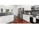 Modern kitchen featuring stainless steel appliances, and a view to the eat-in area at 2358 Alexander Farms Sw Ct, Marietta, GA 30064