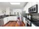 Modern kitchen with stainless steel appliances, black countertops, and ample cabinet space is great for cooking at 2358 Alexander Farms Sw Ct, Marietta, GA 30064