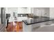 Spacious kitchen with black countertops, stainless steel appliances, and a view to the breakfast nook at 2358 Alexander Farms Sw Ct, Marietta, GA 30064