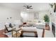Inviting living room with hardwood floors, a fireplace, and comfortable seating for relaxation and entertaining at 2358 Alexander Farms Sw Ct, Marietta, GA 30064