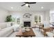 Bright living room with a modern fireplace, comfortable seating, and natural light at 2358 Alexander Farms Sw Ct, Marietta, GA 30064