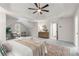 Large main bedroom with tray ceiling, plush carpet, and comfortable seating for relaxing and unwinding at 2358 Alexander Farms Sw Ct, Marietta, GA 30064