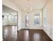 An inviting dining area with decorative molding, wood floors, and an adjacent living space at 2463 Turnbury Glen Walk, Snellville, GA 30078