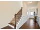 Inviting home foyer boasting hardwood floors and a staircase at 2463 Turnbury Glen Walk, Snellville, GA 30078