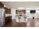 The kitchen has stainless steel appliances, a center island, and dark wood cabinets at 2463 Turnbury Glen Walk, Snellville, GA 30078