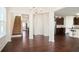 The living room has a wooden floor and is adjacent to the kitchen at 2463 Turnbury Glen Walk, Snellville, GA 30078